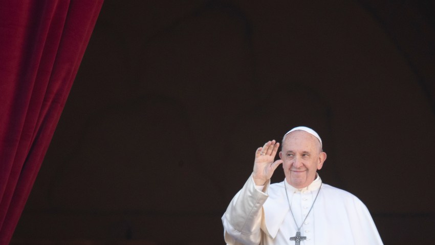 Pope Francis waves to faithful as he arrives to deliver the Urbi et Orbi on Christmas Day, Dec. 25, 2019.