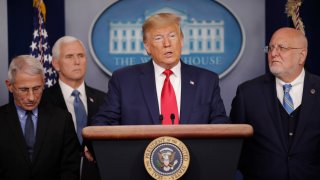 President Donald Trump, center, speaks to members of the media to address the nation about the coronavirus threat in the Brady Press Briefing room of the White House in Washington, Saturday, Feb. 29, 2020. With Trump are from l-r., National Institute for Allergy and Infectious Diseases Director Dr. Anthony Fauci, Vice President Mike Pence and CDC Director Robert Redfield.