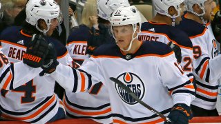 Edmonton Oilers' Colby Cave (12) returns to the bench after scoring during the second period of an NHL hockey game
