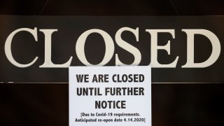 In this April 2, 2020 file photo, a notice of closure is posted at The Great Frame Up in Grosse Pointe Woods, Mich. The government has reached its limit on the $349 billion lending limit on its Paycheck Protection Program that is sending relief money to the nation’s small businesses.