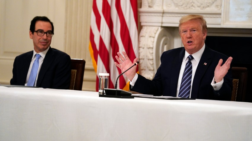 President Donald Trump speaks during a meeting with Republican lawmakers, in the State Dining Room of the White House, Friday, May 8, 2020, in Washington. Treasury Secretary Steven Mnuchin listens at left.