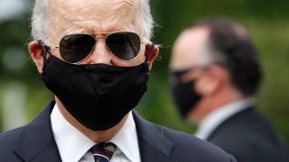 Democratic presidential candidate, former Vice President Joe Biden wears a face mask to protect against the spread of the new coronavirus as he and Jill Biden depart after placing a wreath at the Delaware Memorial Bridge Veterans Memorial Park, Monday, May 25, 2020, in New Castle, Del.