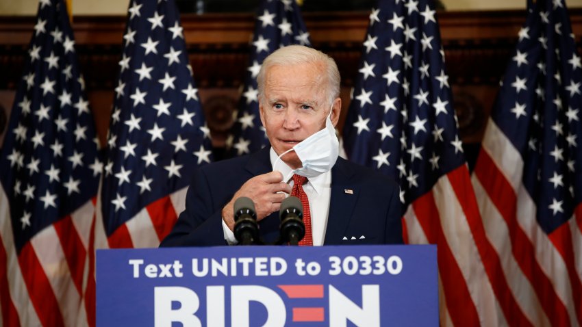 Former Vice President and Democratic presidential candidate Joe Biden removes his mask as he speaks in Philadelphia, Tuesday, June 2, 2020.