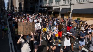 Activists move along Seventh Avenue