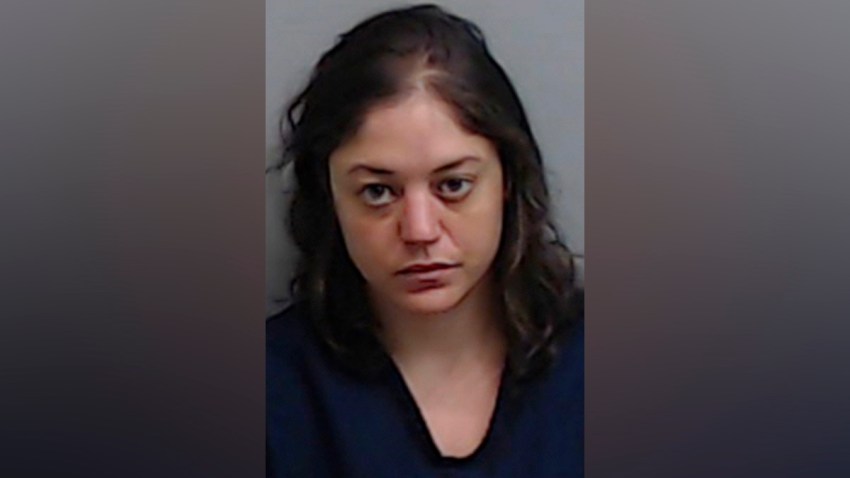 This booking photo released by the Fulton County, Ga., Jail shows Natalie White, who was charged on June 23, 2020, with first degree arson in the burning of an Atlanta Wendy's in the wake of the Rayshard Brooks shooting.