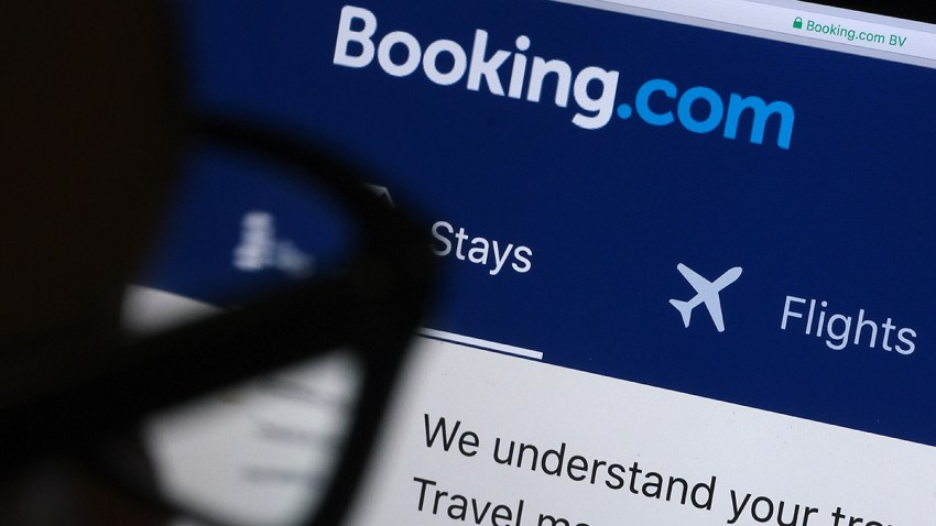 A man looks at the website of Booking.com, April 20, 2020, in Katwijk, Netherlands.