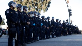 California Highway Patrol officers stand guard during a protest for the killing of George Floyd.