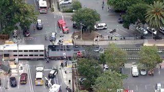 First responders work at the scene of a Caltrain vs. pedestrian collision near the Menlo Park Station.