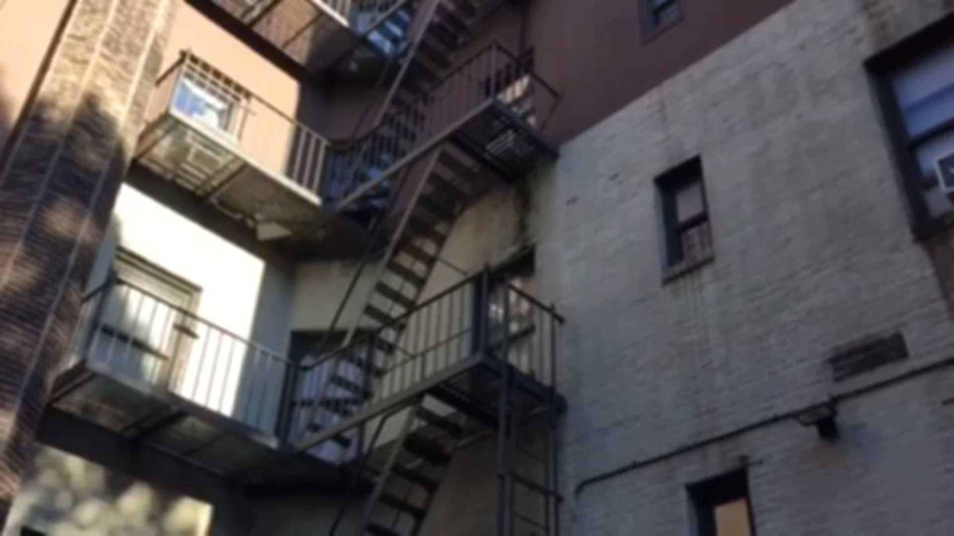 woman falling from fire escape