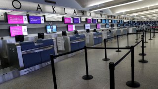 Empty counters are seen at Oakland International Airport's Terminal 1.