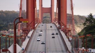 Light traffic moves along the Golden Gate Bridge during rush hour in San Francisco.
