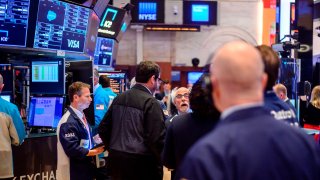 Traders work during the opening bell at the New York Stock Exchange