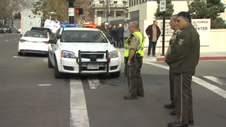 Authorities work outside two evacuated courthouses in San Jose.