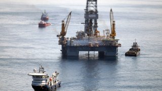 Ships work near the site of the BP Deepwater Horizon oil spill
