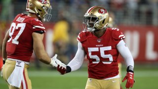 Dee Ford #55 of the San Francisco 49ers congratulates Nick Bosa #97 during the game against the Seattle Seahawks at Levi's Stadium on November 11, 2019 in Santa Clara, California.