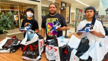 Kevin Zaragoz, Saint Hicks and Toño Bustamante load up on Air Jordans on the reopening day of Solano Town Center mall in Fairfield.