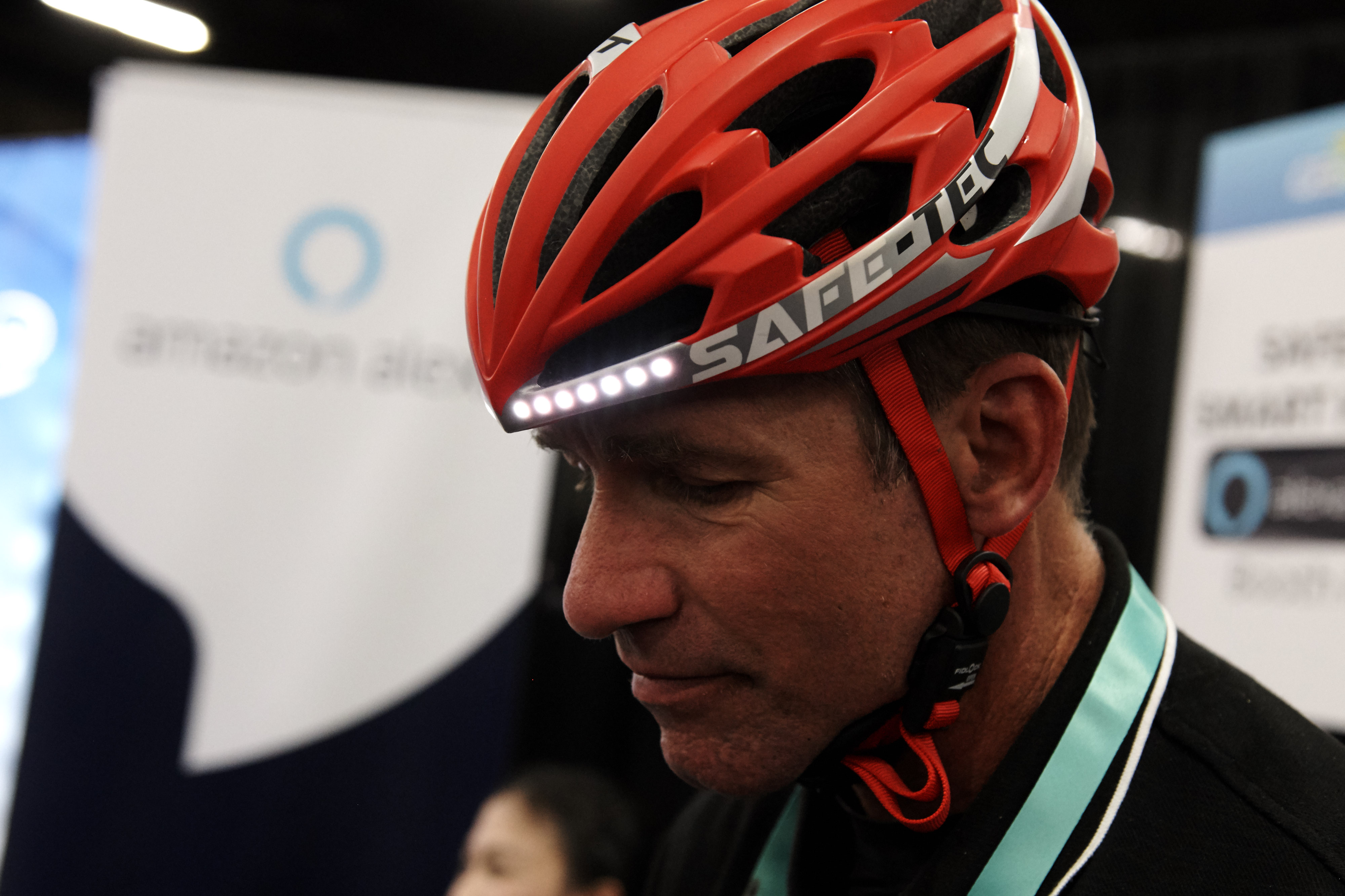 A person wears a Safe-Tec Smart Helmet during CES Unveiled at the CES 2020 at the Mandalay Bay Convention Center, Jan. 5, 2020, in Las Vegas, Nevada. The smart helmet is a Bluetooth-enabled bone conduction speaker and microphone that also features LED strips and brake light for safety.