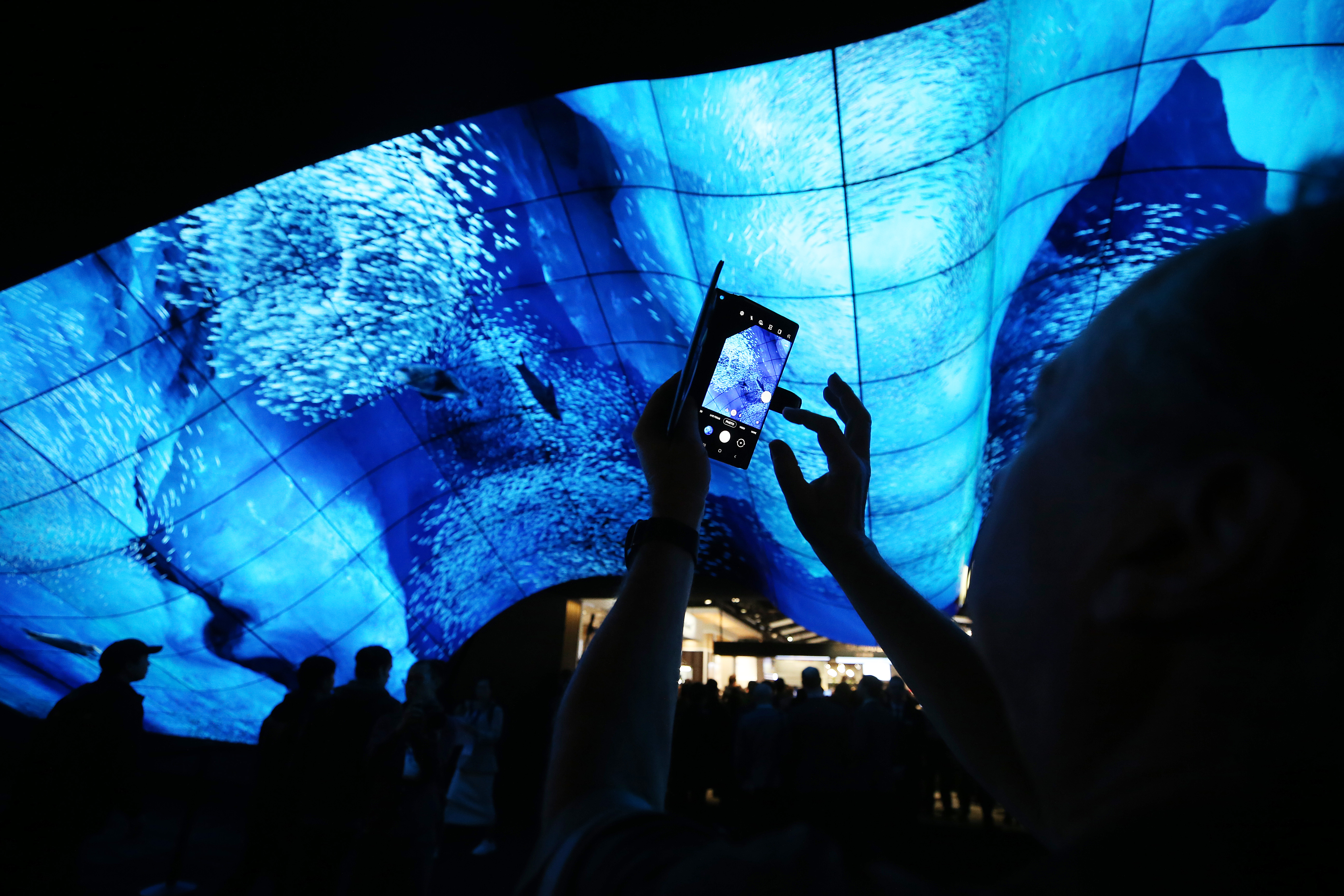 Curved OLED screens seen above the LG Electronics booth during CES 2020 at the Las Vegas Convention Center on Jan. 7, 2020, in Las Vegas, Nevada.