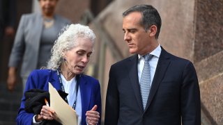 Los Angeles County Public Health director Barbara Ferrer (L) and Los Angeles Mayor Eric Garcetti speak as they arrive for a press conference on March 4, 2020, in Los Angeles.