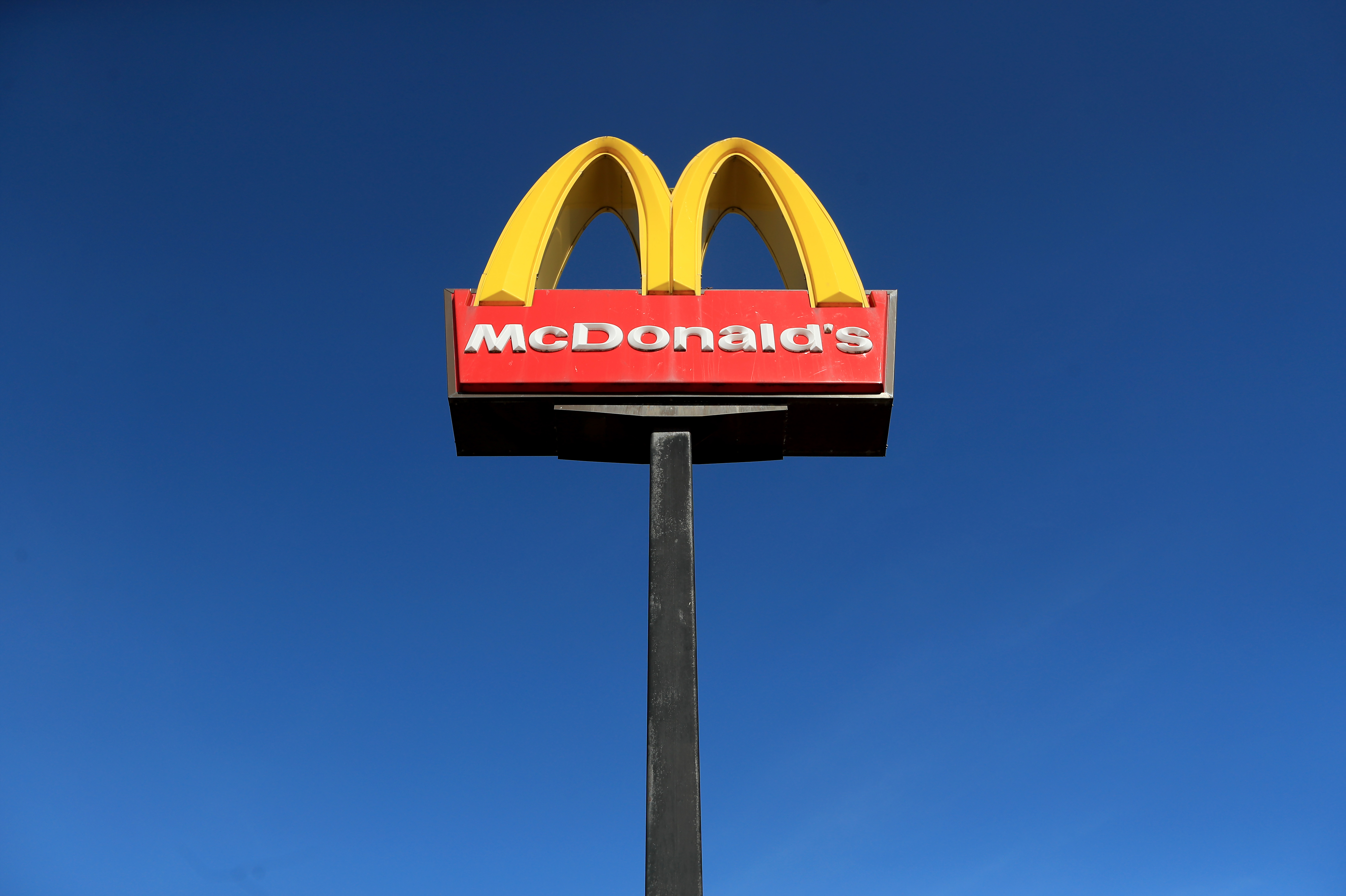 A sign in front of McDonald's