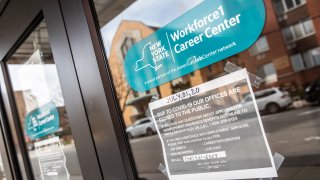 Signage is displayed on a closed New York State Department of Labor building