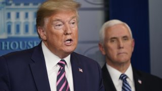 President Donald Trump speaks as Vice President Mike Pence listens during a news conference in the White House in Washington, D.C., U.S., on Friday, April 24, 2020.