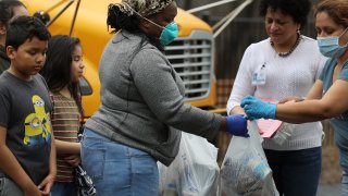 Dozens of families receive food distributed