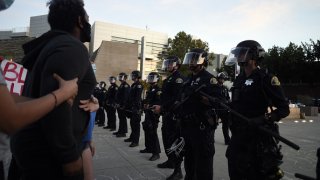 Police take security measures as a small group of protestors showed up at the San Jose City Hall, site of Friday nights demonstration turned riot following the death of George Floyd in Minneapolis on May 30, 2020 in California, United States. (Photo by Neal Waters/Anadolu Agency via Getty Images)