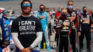 Bubba Wallace, driver of the #43 McDonald's Chevrolet, wears a "I Can't Breath - Black Lives Matter" T-shirt under his fire suit in solidarity with protesters around the world taking to the streets after the death of George Floyd
