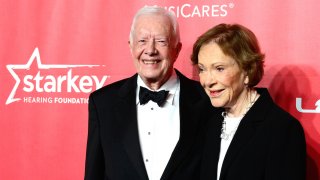 Former President Jimmy Carter (L) and former first lady Rosalynn Carter