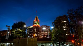 Downtown Oakland with Tribune Building at night.
