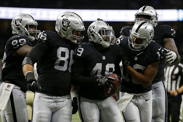 Raiders, Carr beat Chargers, clinch first playoff berth since 2002