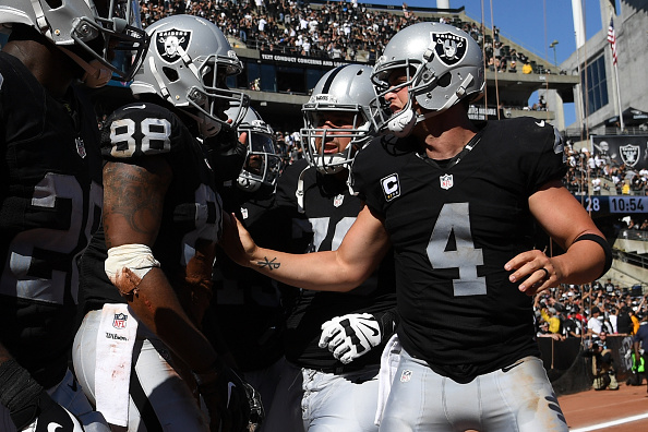 Raiders edge Chargers to clinch first playoff berth since 2002