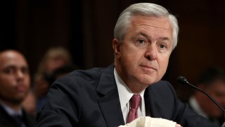 John Stumpf, then-chairman and CEO of Wells Fargo, testifies before the Senate Banking, Housing and Urban Affairs Committee on Sept. 20, 2016 in Washington.