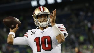 Jimmy Garoppolo of the San Francisco 49ers passes on the field