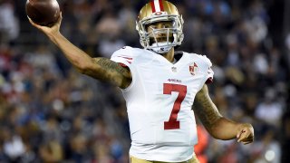 Colin Kaepernick #7 of the San Francisco 49ers makes a pass on the run during a preseason game against the San Diego Chargers at Qualcomm Stadium on September 1, 2016 in San Diego, California.