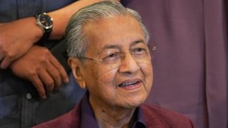 In this Feb. 22, 2020, file photo, Malaysian Prime Minister Mahathir Mohamad, speaks during a press conference in Putrajaya, Malaysia. Malaysia's alliance government under 94-year-old Prime Minister Mahathir is threatening to unravel less than two years after a historic election victory ousting the coalition that had ruled the country since independence.