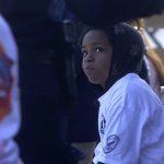 Michaela watches officer