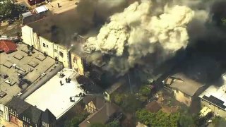 Firefighters battle a blaze in Oakland.