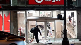 A looter robs a Target store.