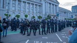 Police are seen during a protest against the death in Minneapolis police custody of African-American man George Floyd at San Francisco City Hall.