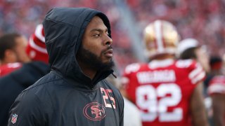 Richard Sherman of the San Francisco 49ers looks on from the sideline.