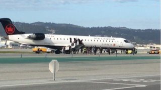Airplane makes emergency landing and evacuation at San Francisco International Airport.