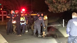 Crews rescue a cold and muddy driver in San Jose.