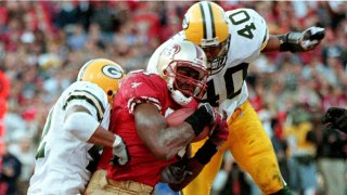 San Francisco 49ers wide receiver Terrell Owens (C) hauls in the game-winning touchdown on a pass from 49ers quarterback Steve Young.