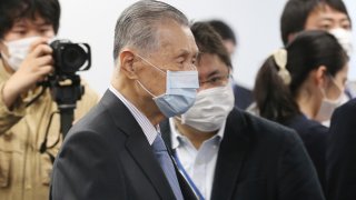 In this March 26, 2020, file photo, Tokyo 2020 Organizing Committee President Yoshiro Mori arrives for the first meeting of the "Tokyo 2020 New Launch Task Force" in Tokyo, Japan.