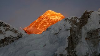 In this Nov. 12, 2015, file photo, Mt. Everest is seen from the way to Kalapatthar in Nepal. Nepal mountaineering authorities have determined that an Indian couple faked a Mount Everest ascent earlier this year by altering photographs to show they were on the summit.Mountaineering Department official Gyanendra Shrestha said the government has canceled the climbing certificate issued to Indian citizens Dinesh and Tarakeshwari Rathod and banned them from climbing any mountain in the Himalayan nation for 10 years.