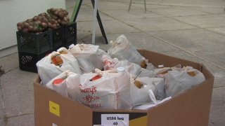 Meals are packed at Oakland Unified to be delivered to students. (April 16, 2020)