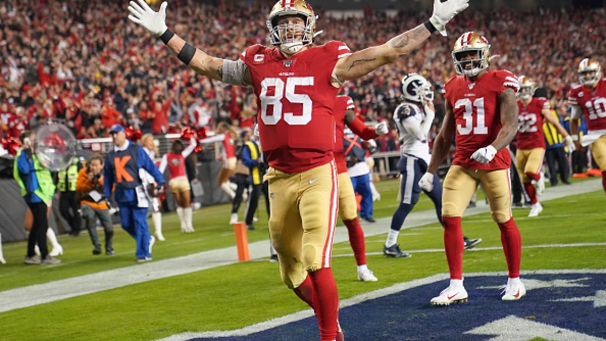 FILE - San Francisco 49ers tight end George Kittle (85) catches a touchdown  pass against the Arizona Cardinals during the first half of an NFL football  game in Santa Clara, Calif., Jan.