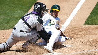 Matt Olson #28 of the Oakland Athletics is tagged out.